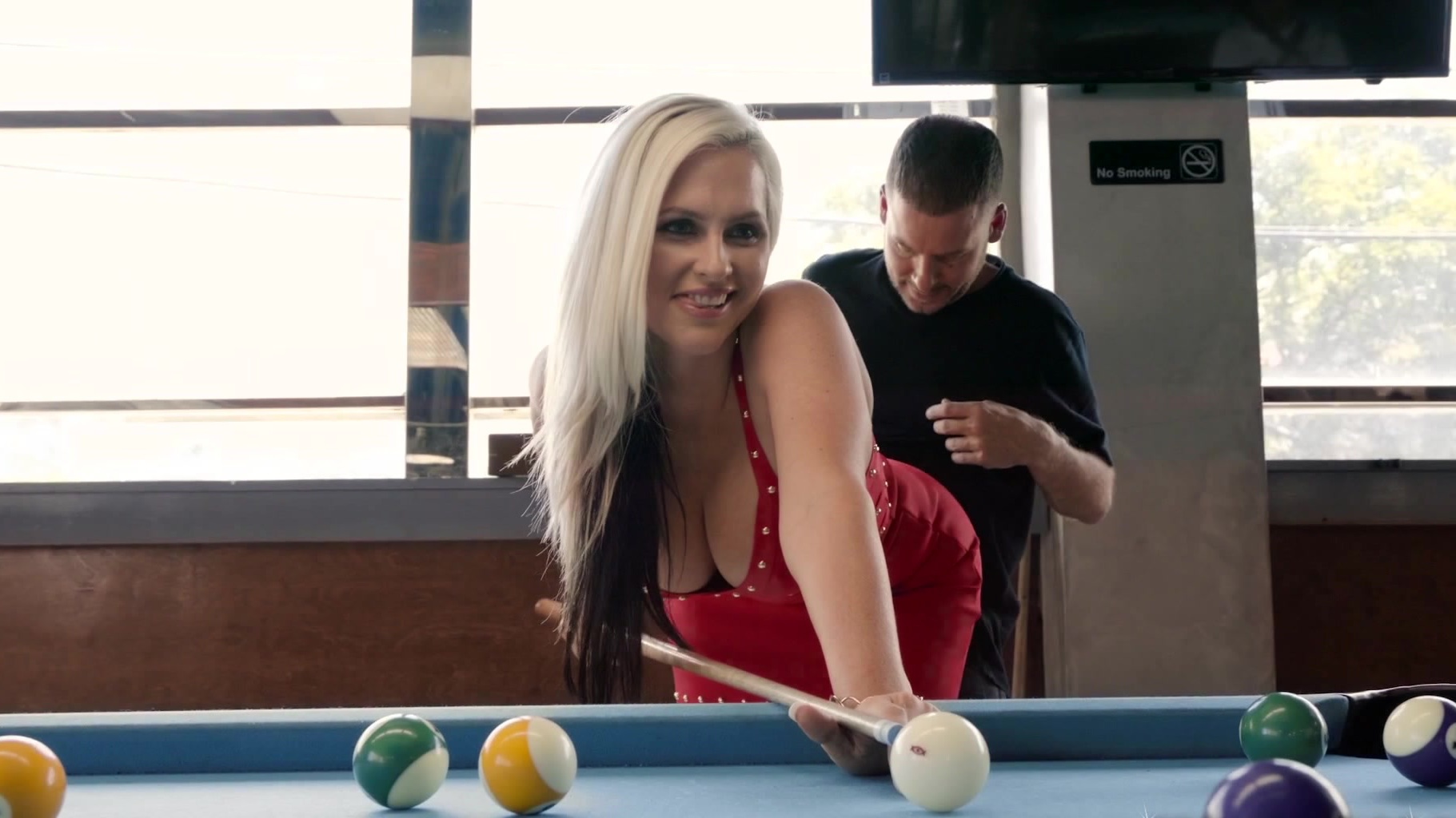 Bent over pool table