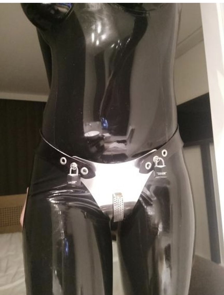 Girl wearing chastity belt with latex