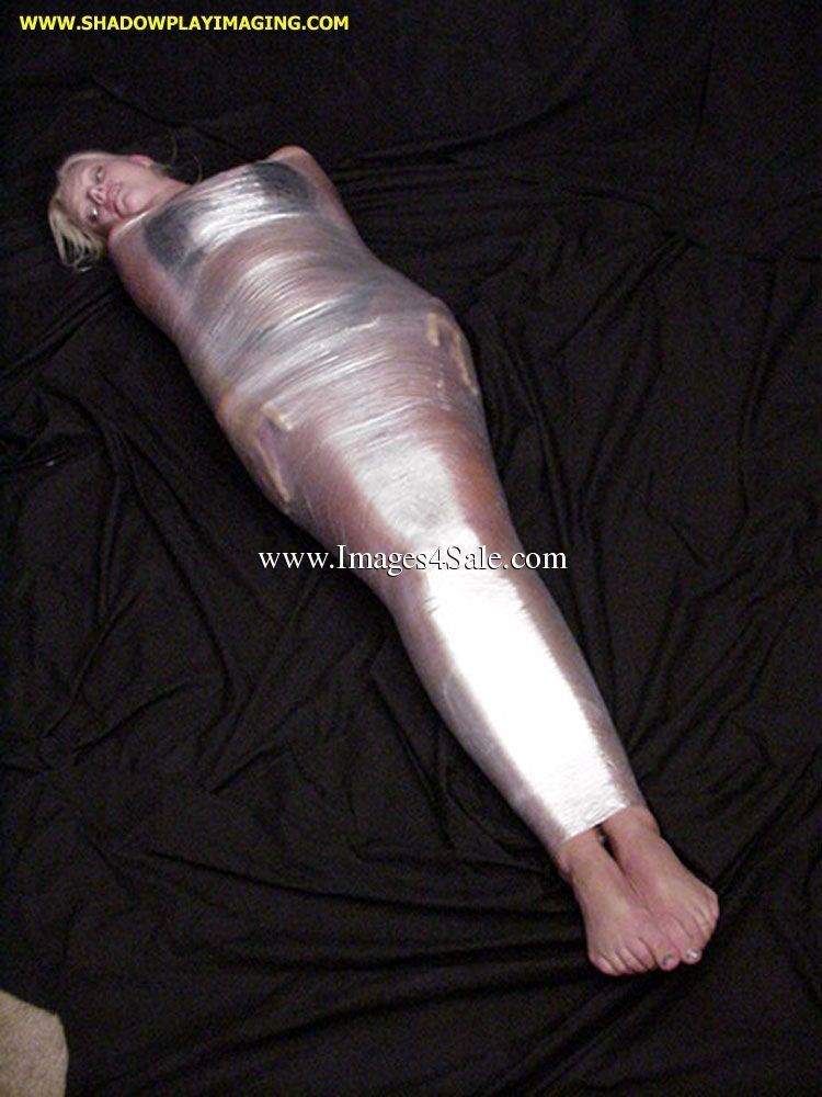 Plastic wrapped bondage girl